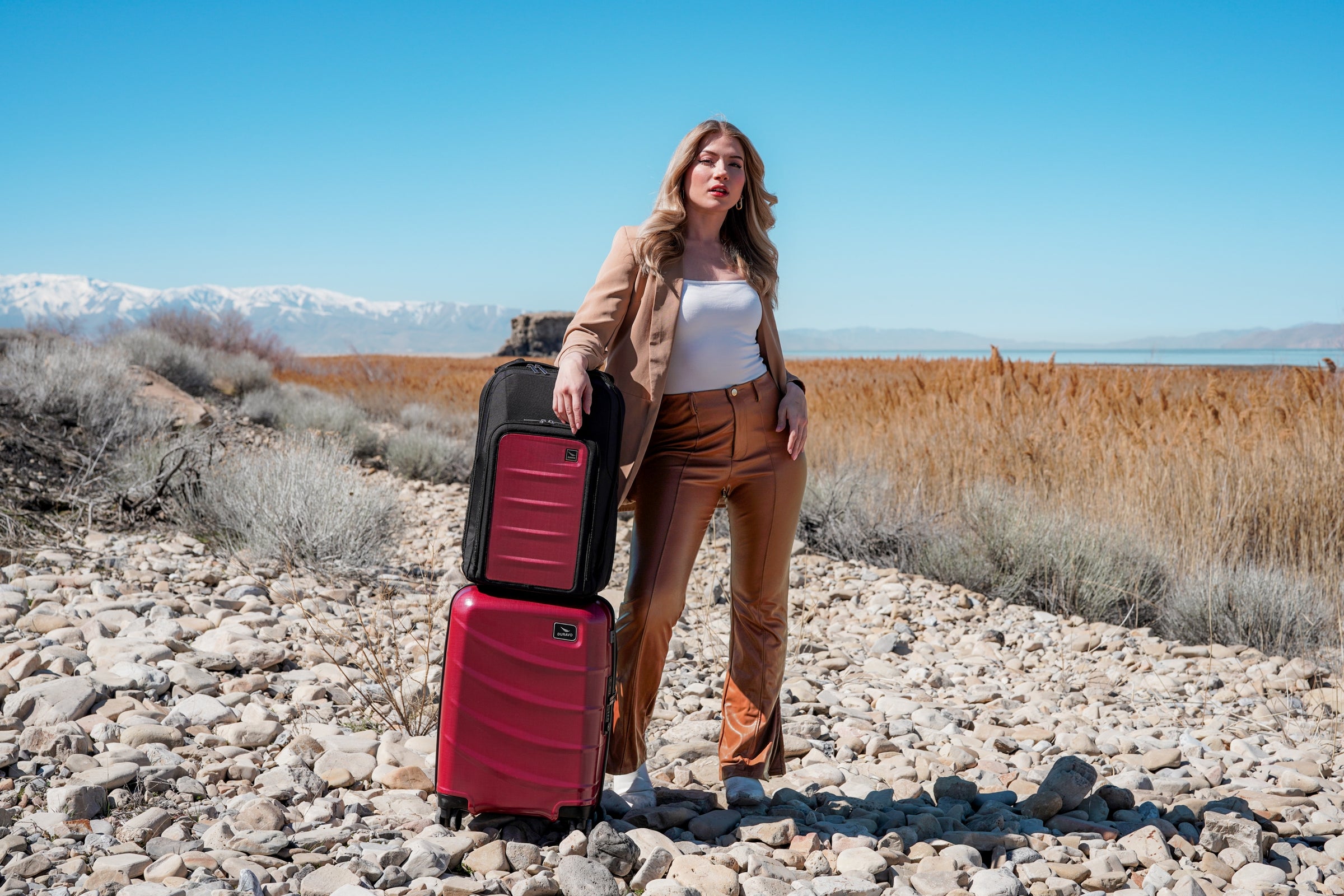 Utah blonde woman with red duravo carry-on and venture backpack