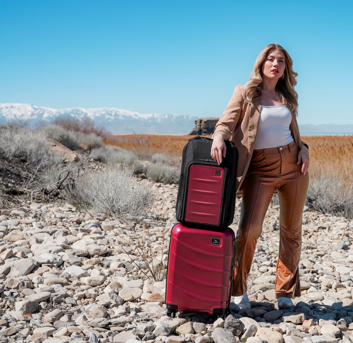Utah blonde woman with red Duravo carry-on and venture backpack mobile